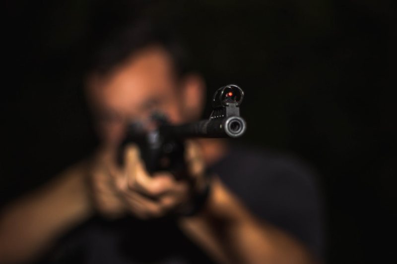 photo of man holding rifle