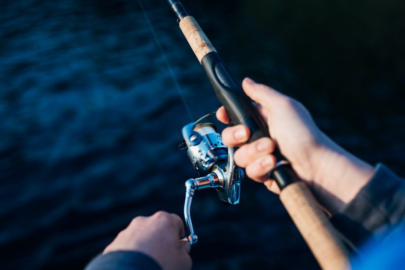photo of person holding fishing rod