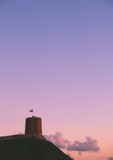 brown castle under blue and pink sky