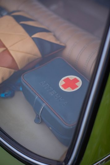 a blue first aid kit leather bag
