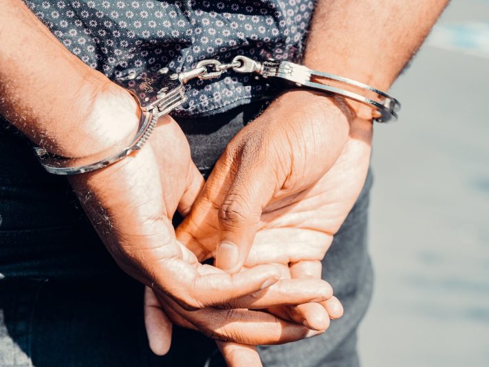 close up photography of person in handcuffs