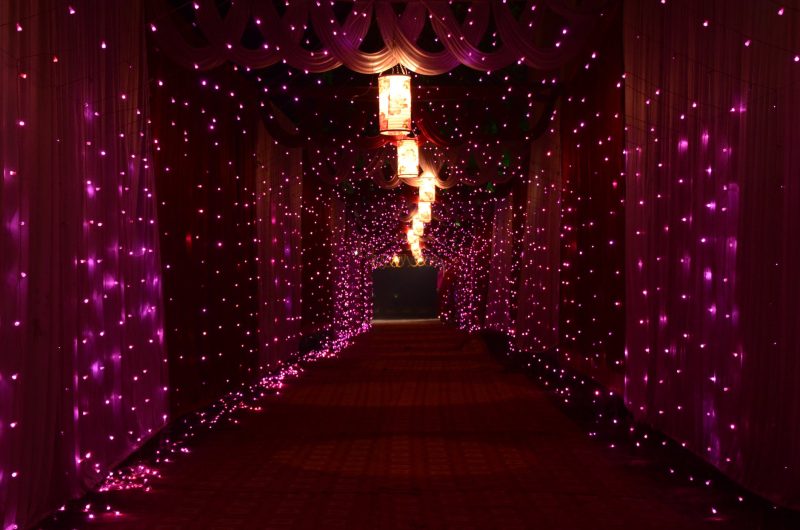 purple string lights and lamps with curtains