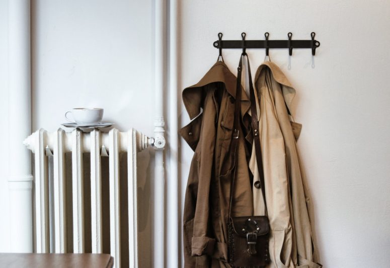 coats and shoulder bag on hooks in house