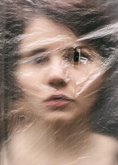 woman face behind plastic foil