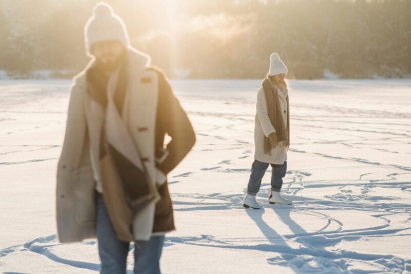 couple on an ice rink covered with snow