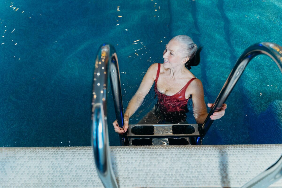 smiling elderly woman at swimming pool