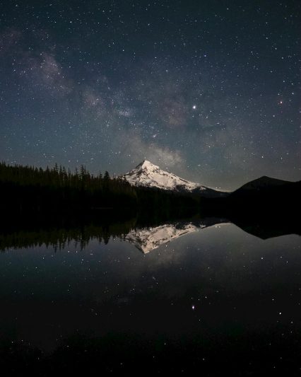 photography of a snowy mountain during nighttime