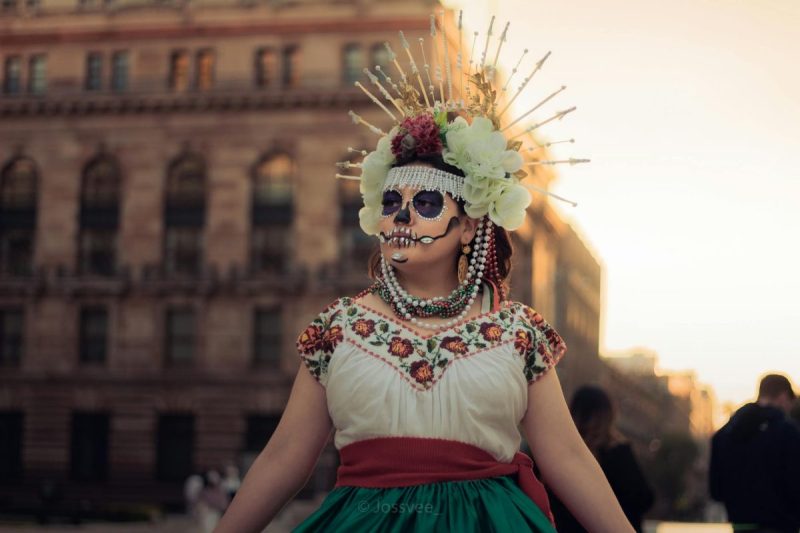 beautiful dancer in costume for dia de muertos