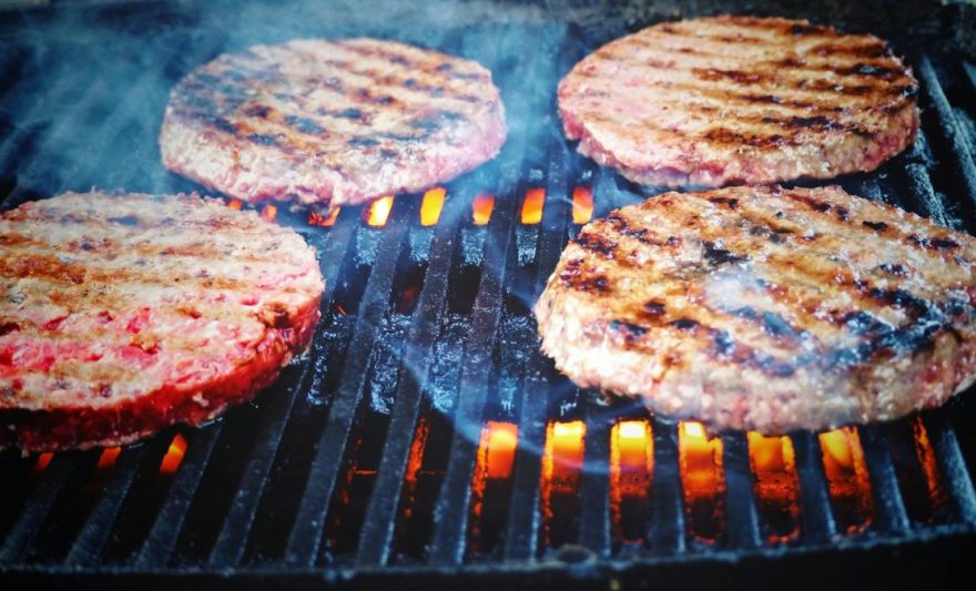 shallow focus photo of patties on grill