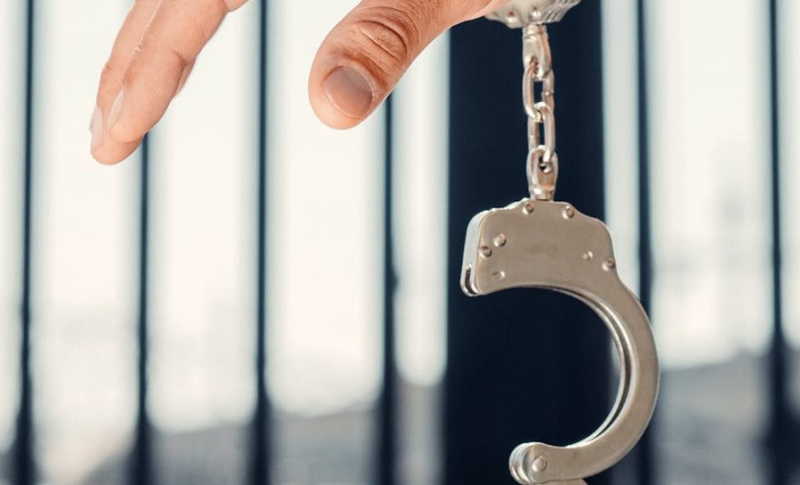 photo of a person s hand with a handcuff