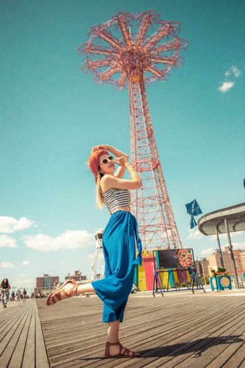 woman wearing white black and blue sleeveless top