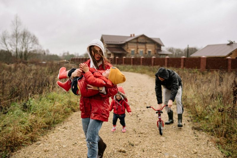 a mother carrying her child while walking