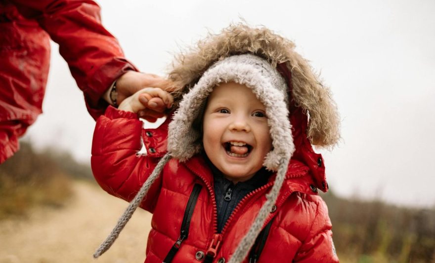 a cute baby in red puffer jacket