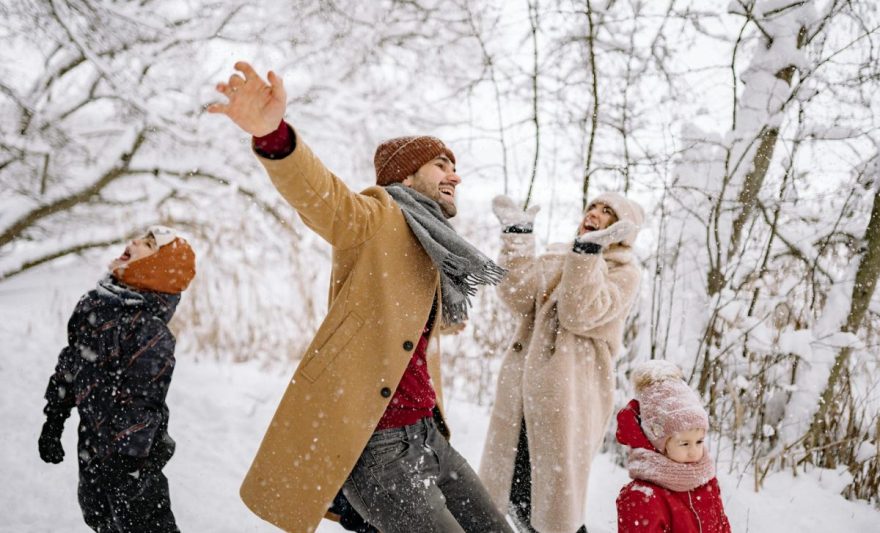 a family enjoying a snow fall