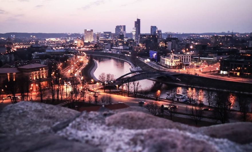 lighted city under white sky