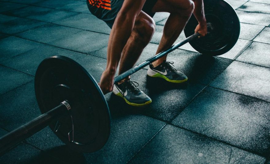 person holding barbell