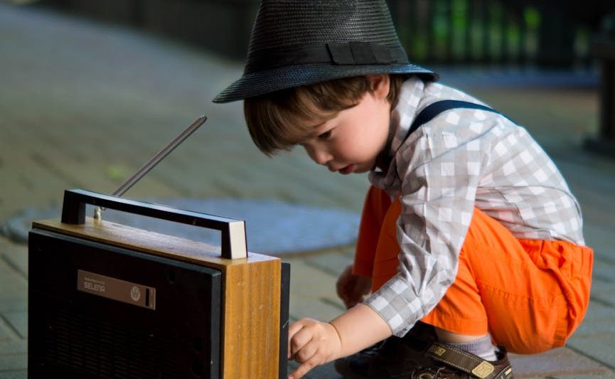 boy tuning transistor radio