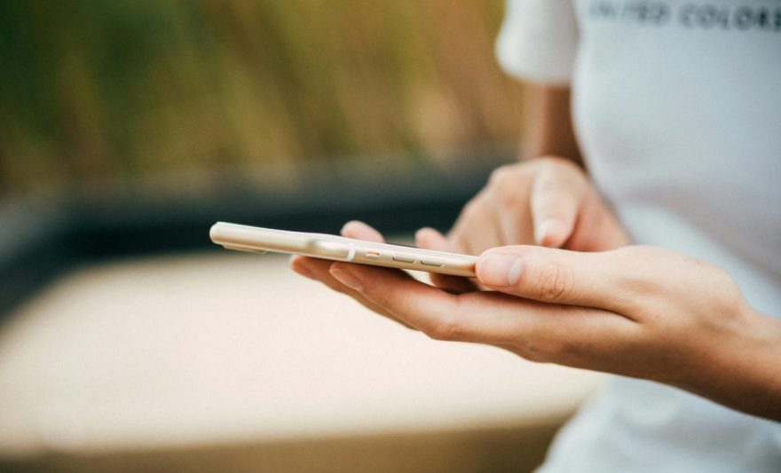 person standing while using phone