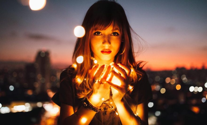 woman holding fireflies