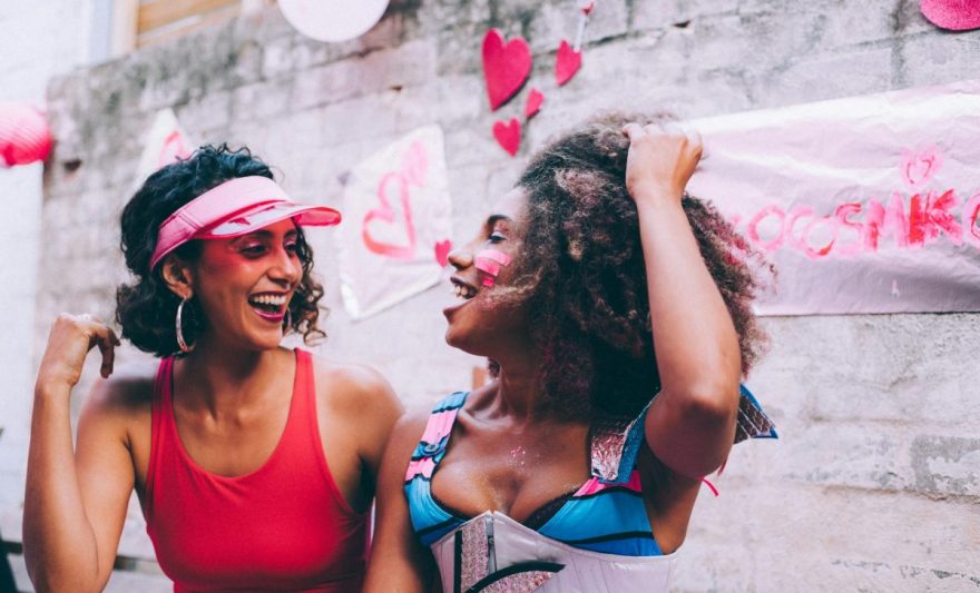 two women laughing at each other
