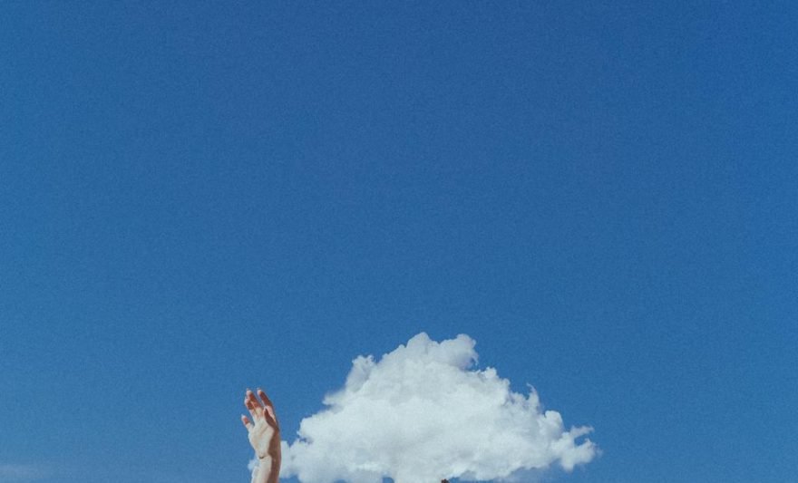 unrecognizable woman covered by white cloud
