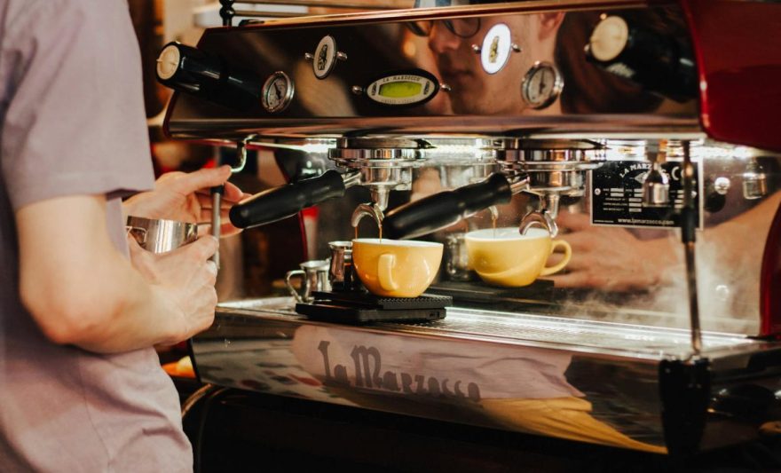 person using espresso machine