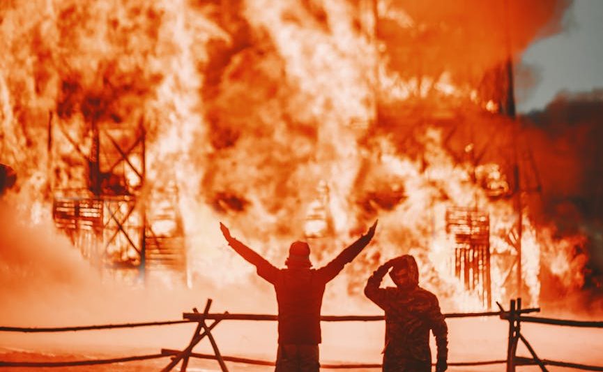 faceless firemen by building on fire