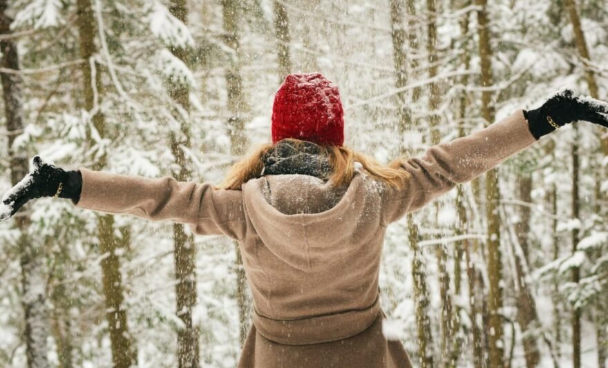 woman wearing brown coat