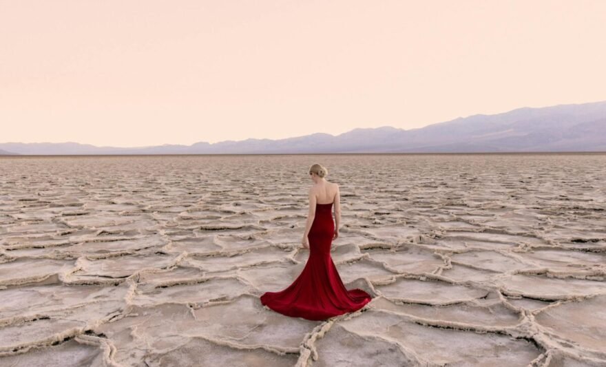 woman in a red dress in a desert