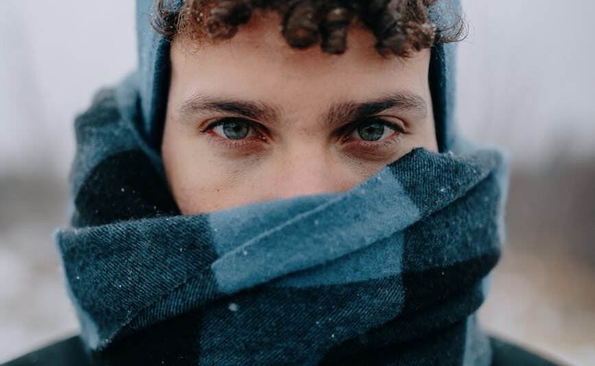 portrait of man in hat and scarf