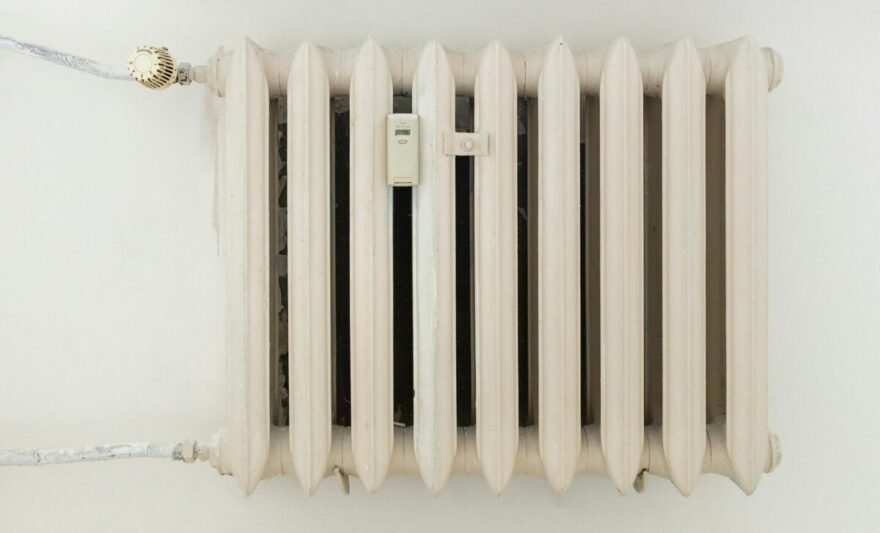 white steel rib radiator in a new bright renovated room in apartment or home