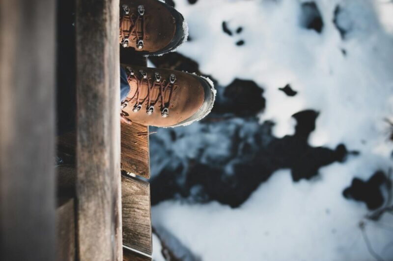 a person standing on the edge of a wooden platform