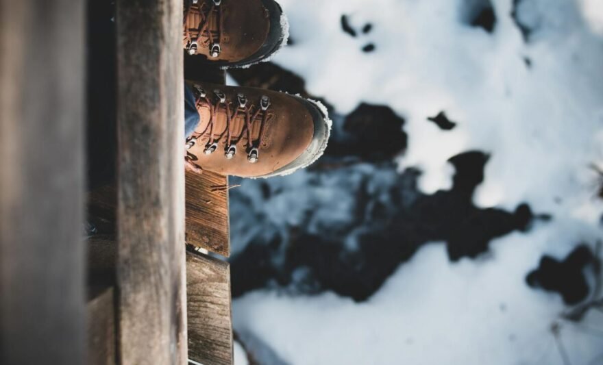 a person standing on the edge of a wooden platform