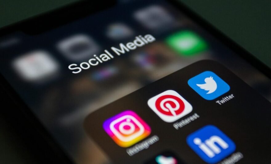 close up of a smartphone screen displaying social media app folder