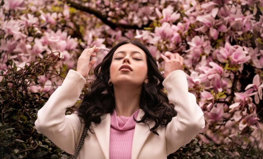 woman enjoying spring blossoms in milano