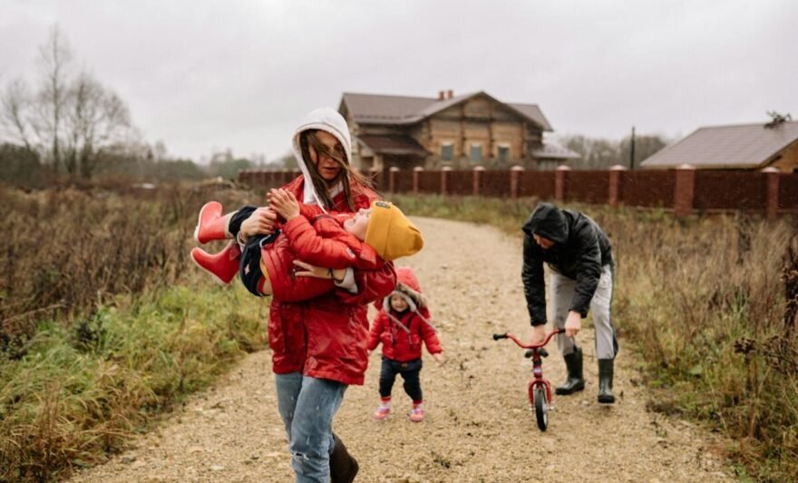 a mother carrying her child while walking