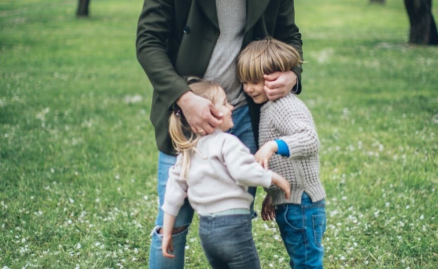 father with his children at a park