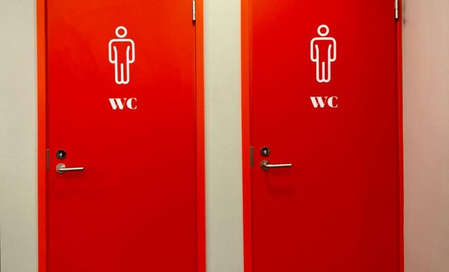 bright red restroom doors with wc signs