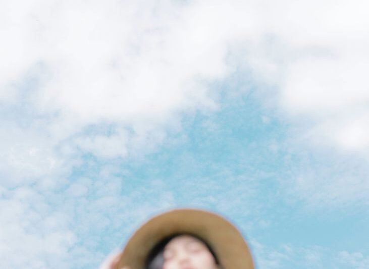 peaceful woman against cloudy sky