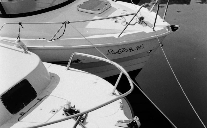 black and white photo of moored boats