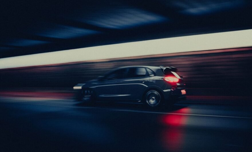 dynamic motion blur of car in dark tunnel