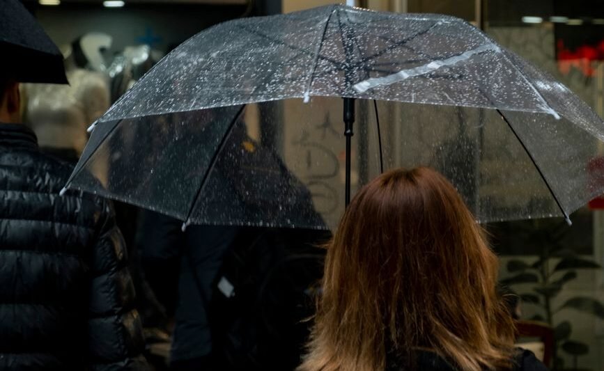 back view of a woman with clear umbrella