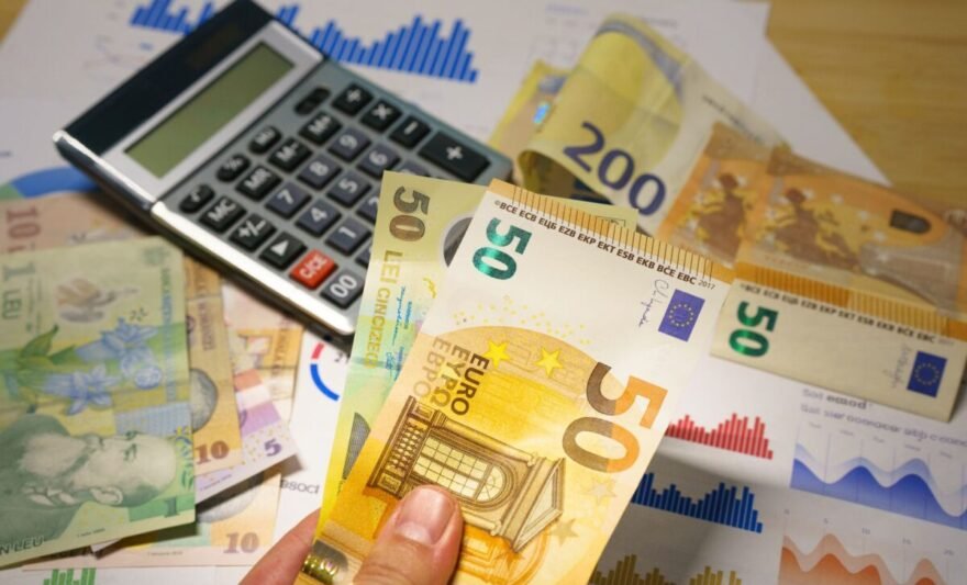euro and lei banknotes with calculator on desk